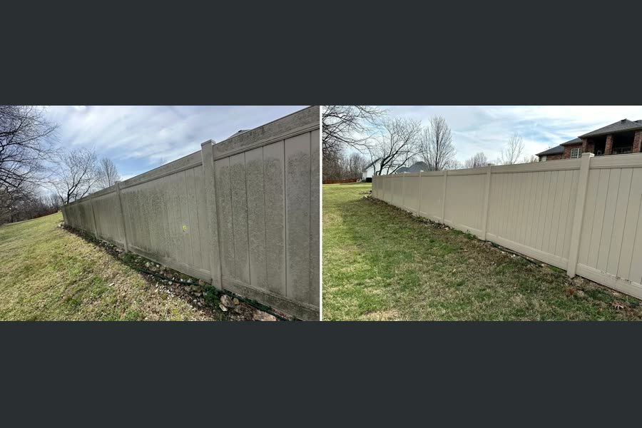 Privacy fence stained grey on one side and clean white on the other after washing